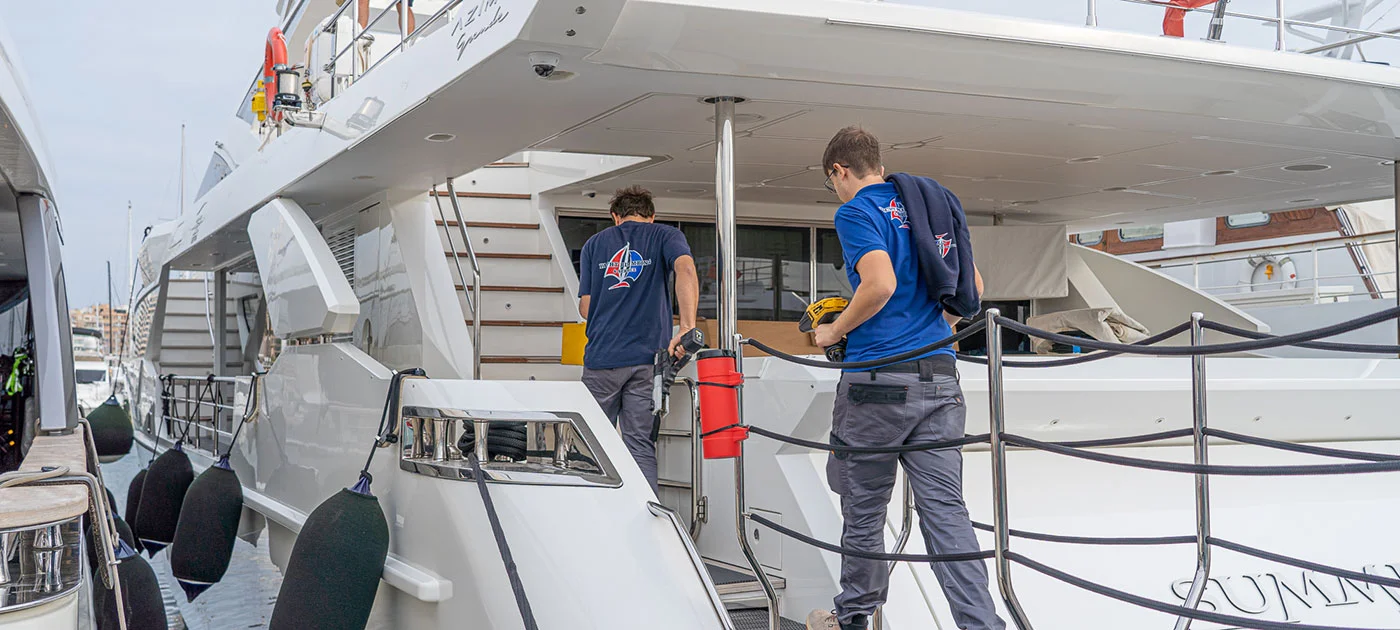 Technicians working on the installation of water systems on a yacht in Palma de Mallorca